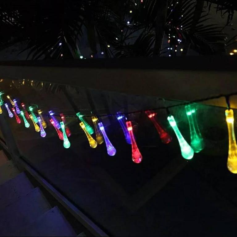 ไฟคริสมาส ไฟปีใหม่ ไฟประดับตกเเต่ง ทรงใสหยดน้ำขนาดใหญ่ จำนวน 70 LED ความยาว 9 เมตร ( หลอดยาว 9 CM ) สายสีดำ งานดี ทนทาน เเสงสีรวม RGB เเบบไฟกระพริบ ใช้สำหรับเป็นไฟเเฟนซีประดับอาคาร ไฟประดับต้นไม้ ไฟประดับต้นคริสมาส ไฟประดับปีใหม่ ไฟงานวัด ไฟเส้นตกเเต่ง