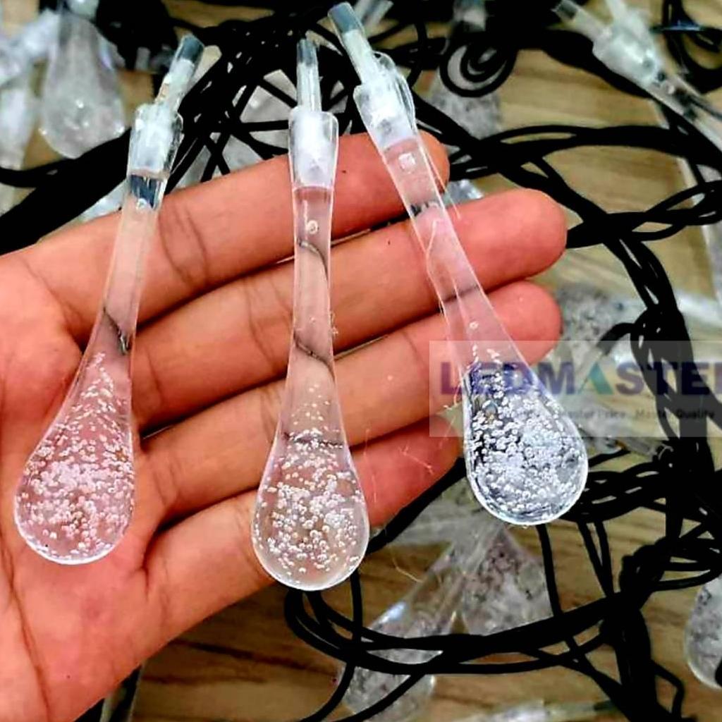 ไฟคริสมาส ไฟปีใหม่ ไฟประดับตกเเต่ง ทรงใสหยดน้ำขนาดใหญ่ จำนวน 100 LED ความยาว 9 เมตร ( หลอดยาว 9 CM ) สายสีดำ งานดี ทนทาน เเสงwarmwhite วอร์มไวท์ ใช้สำหรับเป็นไฟเเฟนซีประดับอาคาร ไฟประดับต้นไม้ ไฟประดับต้นคริสมาส ไฟประดับปีใหม่ ไฟงานวัด ไฟเส้นตกเเต่ง