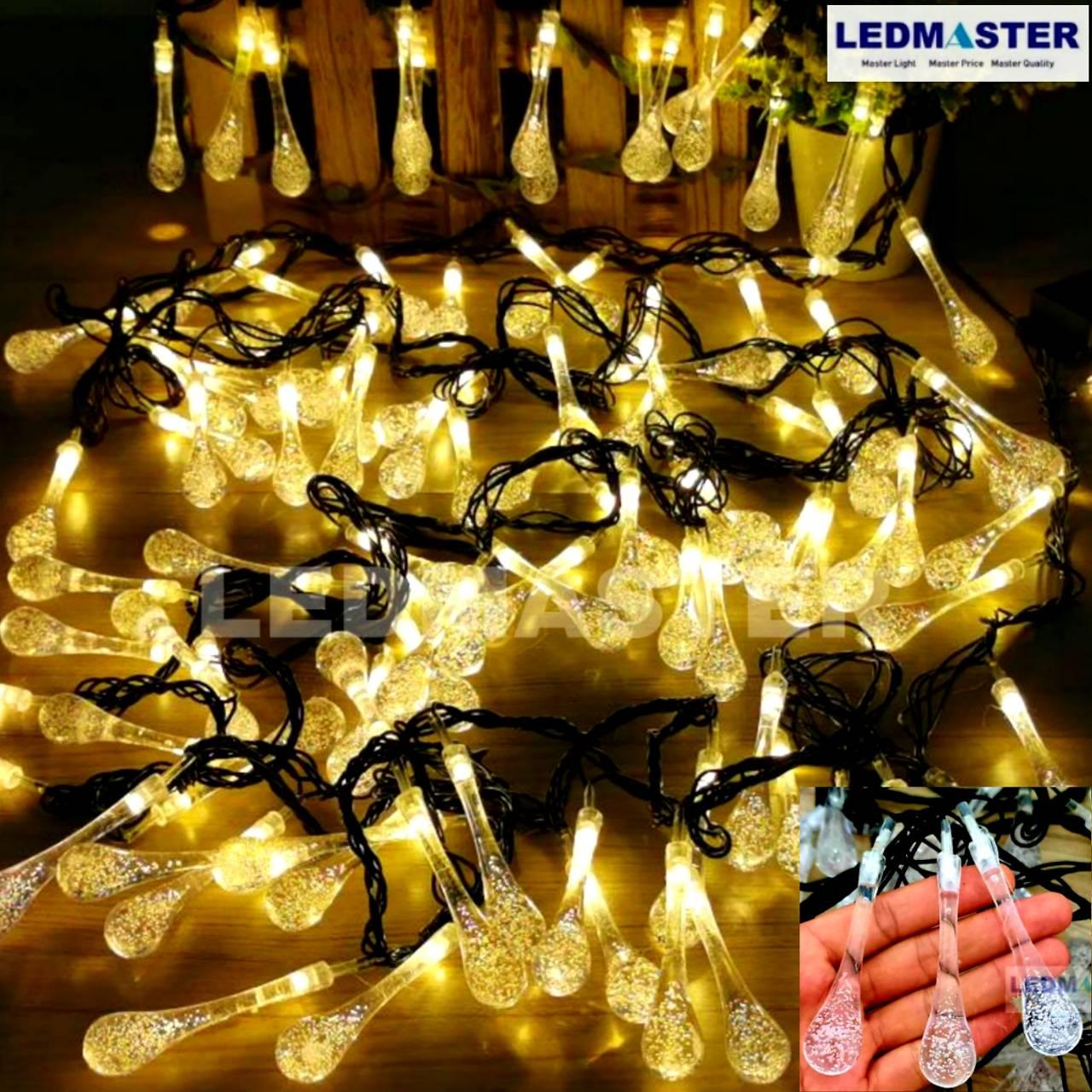 ไฟคริสมาส ไฟปีใหม่ ไฟประดับตกเเต่ง ทรงใสหยดน้ำขนาดใหญ่ จำนวน 100 LED ความยาว 9 เมตร ( หลอดยาว 9 CM ) สายสีดำ งานดี ทนทาน เเสงwarmwhite วอร์มไวท์ ใช้สำหรับเป็นไฟเเฟนซีประดับอาคาร ไฟประดับต้นไม้ ไฟประดับต้นคริสมาส ไฟประดับปีใหม่ ไฟงานวัด ไฟเส้นตกเเต่ง