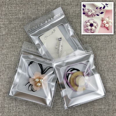 ซองซิปหน้าใสหลังกรอบเทา 12x13 cm. 50 ชิ้น : 004590