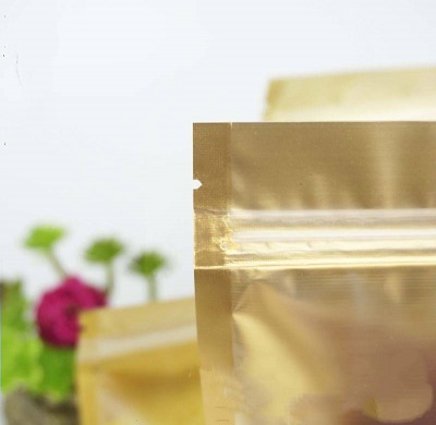 ถุงซองซิปล็อคตั้งได้หน้าใสพื้นทองหลังเงิน