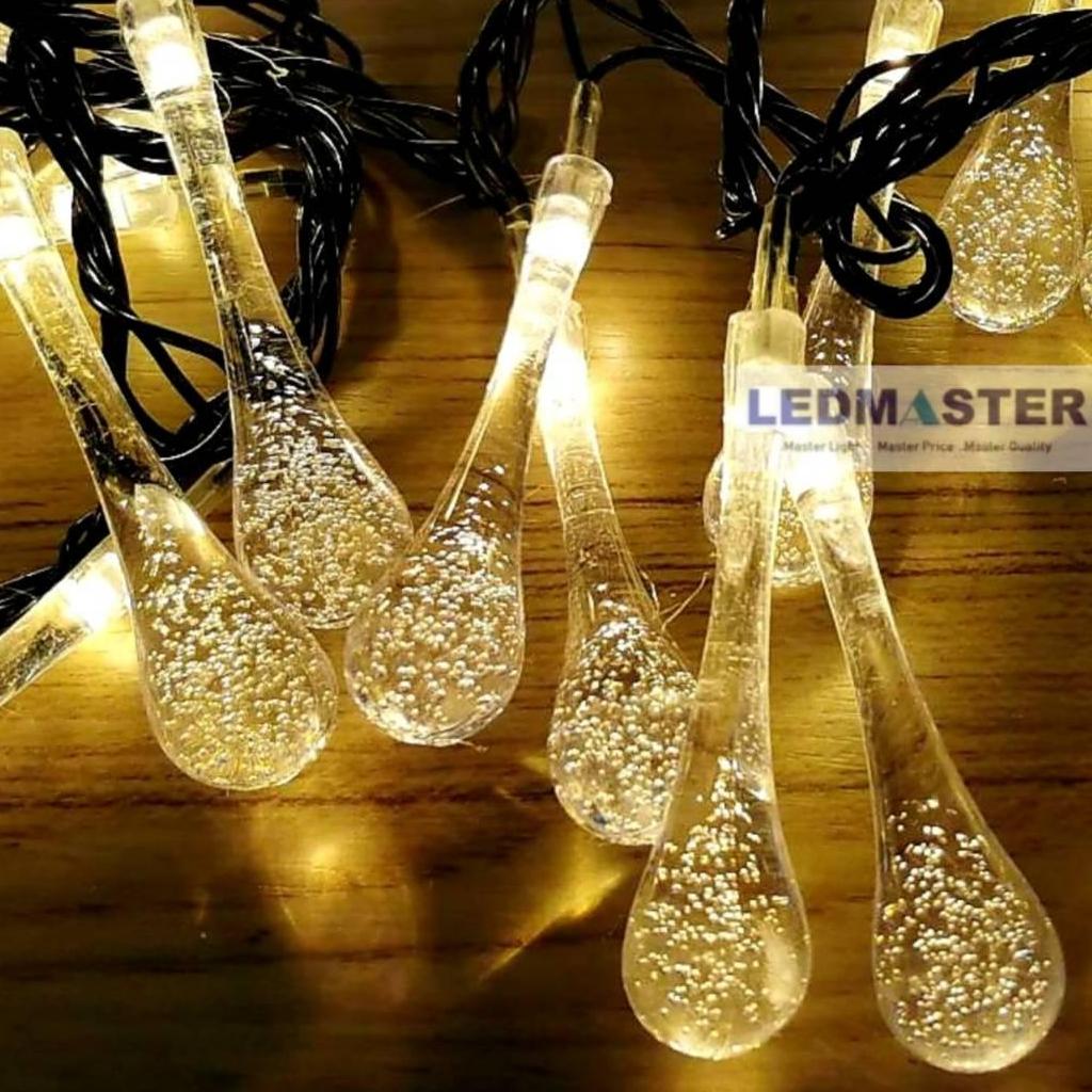 ไฟคริสมาส ไฟปีใหม่ ไฟประดับตกเเต่ง ทรงใสหยดน้ำขนาดใหญ่ จำนวน 100 LED ความยาว 9 เมตร ( หลอดยาว 9 CM ) สายสีดำ งานดี ทนทาน เเสงwarmwhite วอร์มไวท์ ใช้สำหรับเป็นไฟเเฟนซีประดับอาคาร ไฟประดับต้นไม้ ไฟประดับต้นคริสมาส ไฟประดับปีใหม่ ไฟงานวัด ไฟเส้นตกเเต่ง