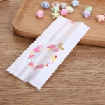 ถุงซองพลาสติกขุ่นขยายข้างสีขาวลายวงรีดอกไม้ ขนาด 5.5x13.5+3 cm แพ็ค 100 ชิ้น