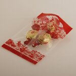 ถุงซองใสซีลกลางสีแดงลายดอกไม้ แพ็ค100ชิ้น (คลิกเพื่อเลือกขนาด)